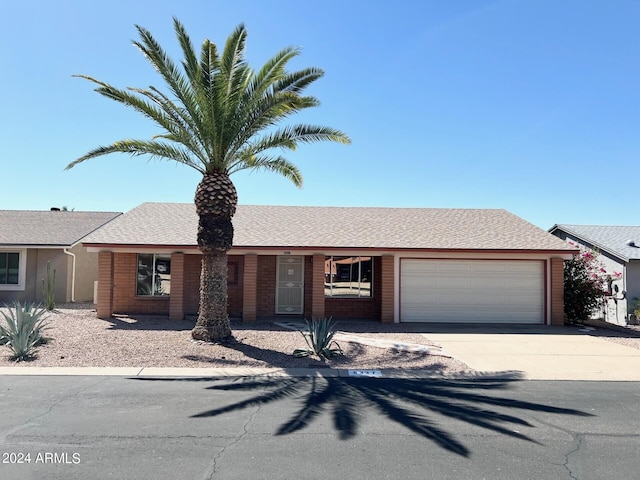 single story home featuring a garage