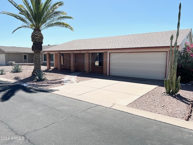 ranch-style home featuring a garage