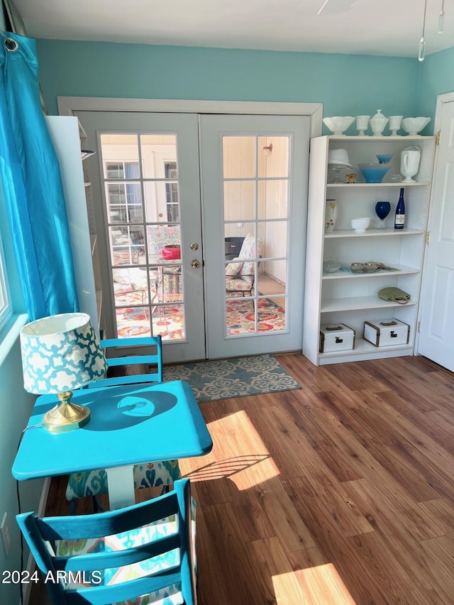 interior space featuring french doors and hardwood / wood-style flooring