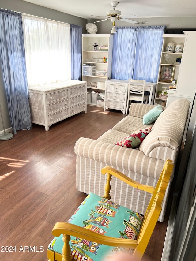 interior space with ceiling fan and dark wood-type flooring