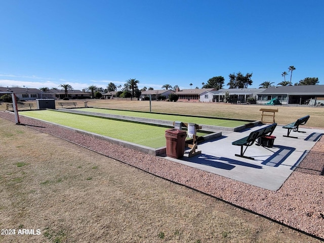 view of home's community featuring a yard