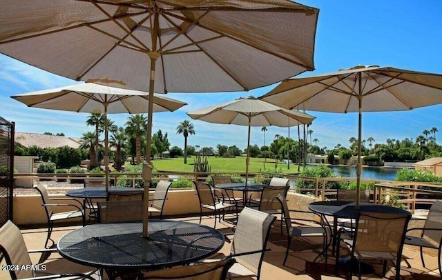 view of patio featuring a water view