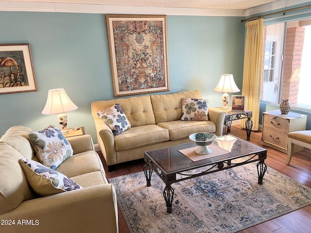 living room with crown molding and hardwood / wood-style floors