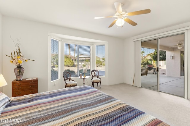 carpeted bedroom with access to exterior and ceiling fan