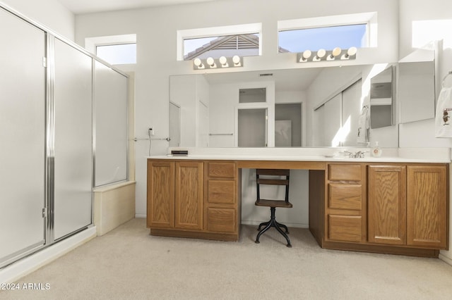 bathroom with vanity and an enclosed shower