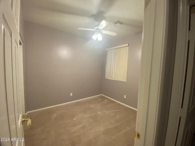 unfurnished bedroom featuring carpet flooring and ceiling fan