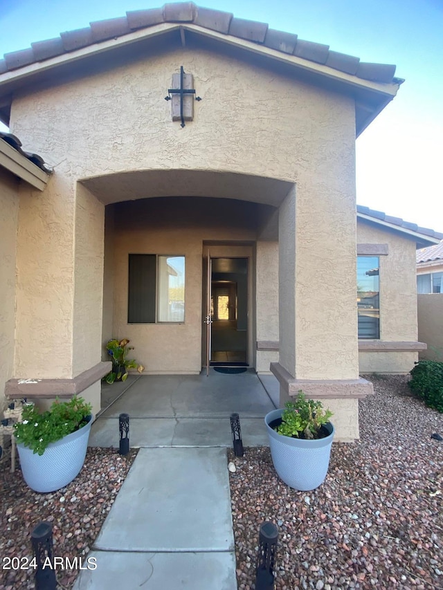 property entrance with a patio area