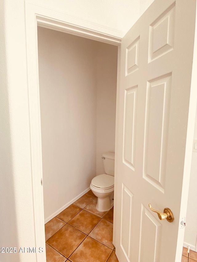 bathroom featuring tile patterned floors and toilet