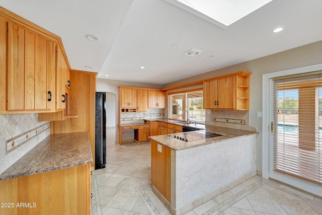 10239 N 125th St, Scottsdale, AZ 85259 - kitchen with black electric cooktop, a sink, a peninsula, inlaid floor details, and recessed lighting