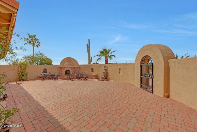 10239 N 125th St, Scottsdale, AZ 85259 - view of patio / terrace featuring exterior fireplace