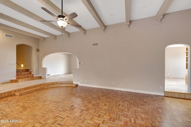 10239 N 125th St, Scottsdale, AZ 85259 - spare room with arched walkways, beamed ceiling, ceiling fan, a high ceiling, and baseboards