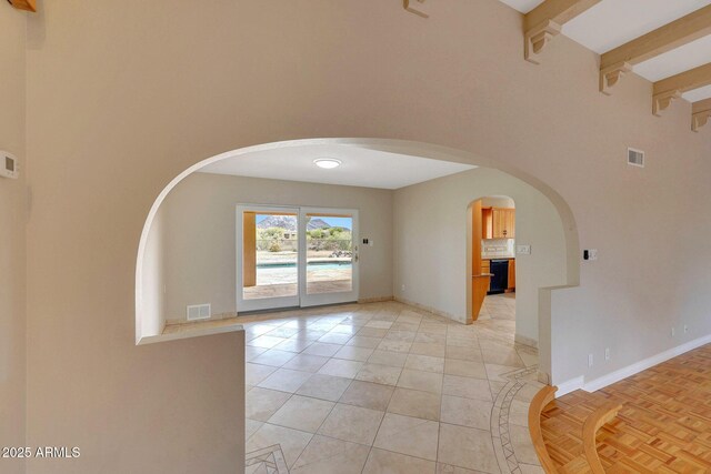 10239 N 125th St, Scottsdale, AZ 85259 - spare room with arched walkways, a high ceiling, baseboards, and beamed ceiling