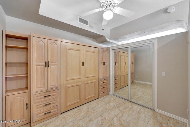 10239 N 125th St, Scottsdale, AZ 85259 - unfurnished bedroom featuring ceiling fan, baseboards, and multiple closets