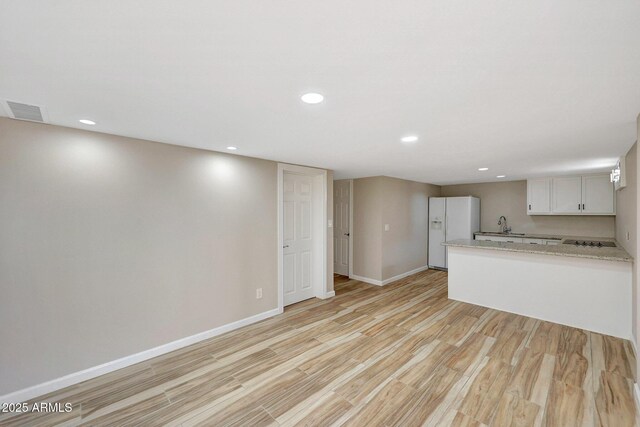 10239 N 125th St, Scottsdale, AZ 85259 - unfurnished living room with light wood-style floors, recessed lighting, and baseboards