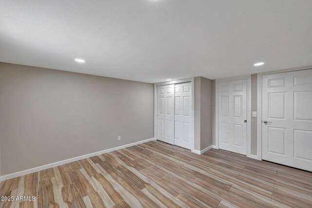 10239 N 125th St, Scottsdale, AZ 85259 - unfurnished bedroom with light wood-type flooring, baseboards, recessed lighting, and a closet
