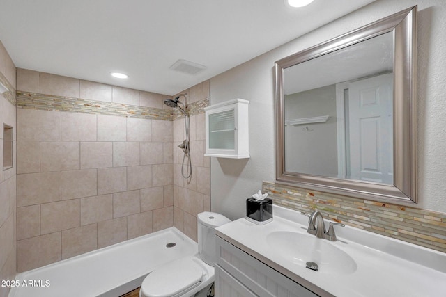 10239 N 125th St, Scottsdale, AZ 85259 - bathroom featuring a tile shower, vanity, and toilet