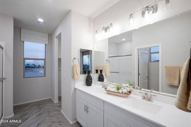 13259 N 145th Ln, Surprise, AZ 85379 - full bath featuring a shower stall, double vanity, a sink, and baseboards