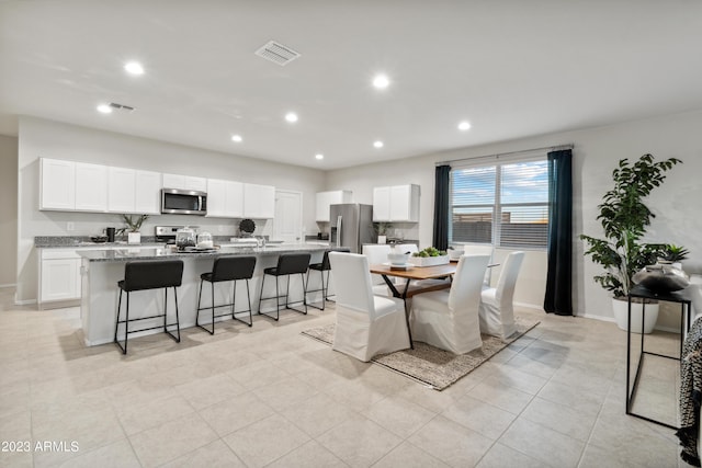 dining room with light tile patterned floors