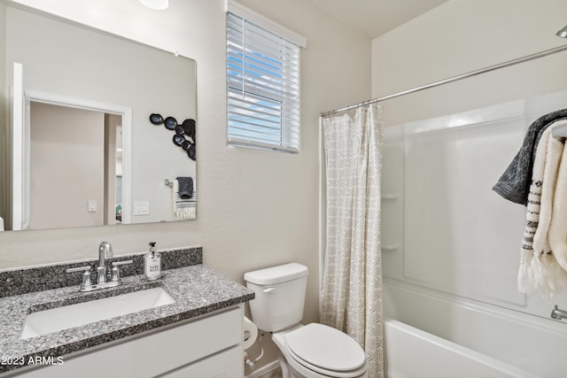 full bathroom featuring vanity, shower / bath combination with curtain, and toilet