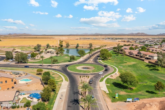 drone / aerial view with a water and mountain view