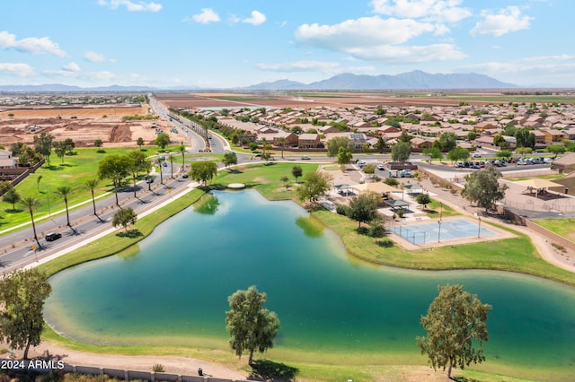 drone / aerial view with a water and mountain view