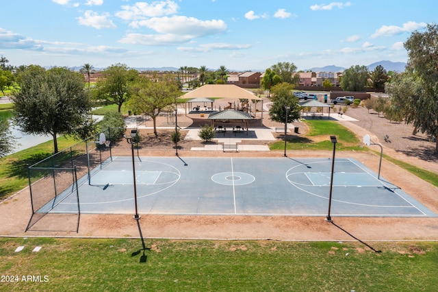 view of sport court with a gazebo and a lawn