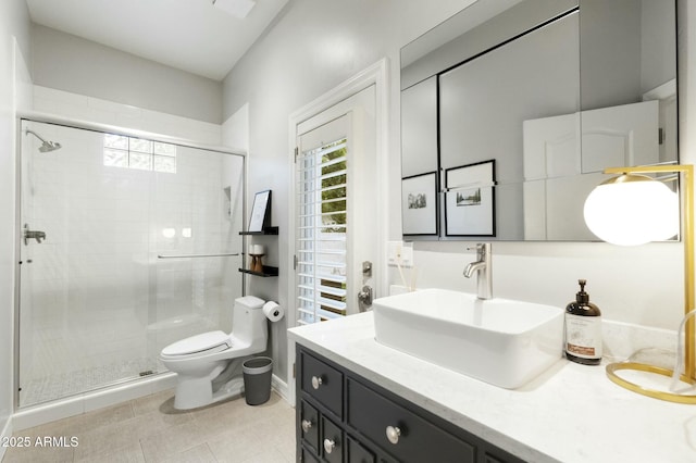 full bathroom featuring toilet, a shower stall, and a wealth of natural light