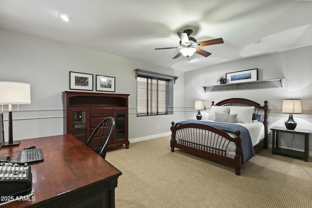 bedroom with light carpet, a ceiling fan, and baseboards