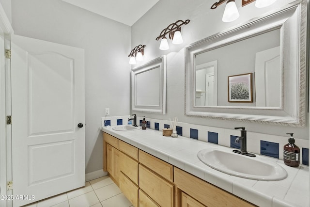 full bath with tile patterned flooring, a sink, and double vanity