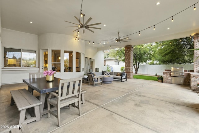 view of patio featuring area for grilling, ceiling fan, exterior kitchen, an outdoor living space, and outdoor dining space