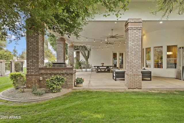 exterior space featuring french doors and a ceiling fan