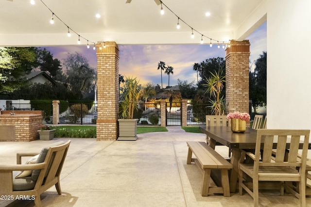 view of patio with fence and outdoor dining space