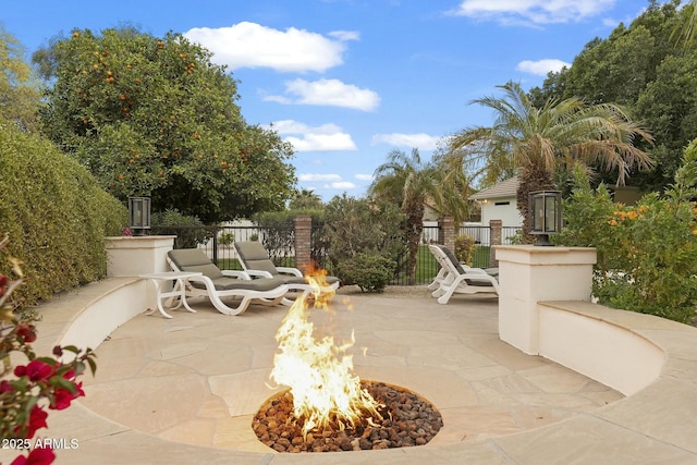 view of patio / terrace with an outdoor fire pit