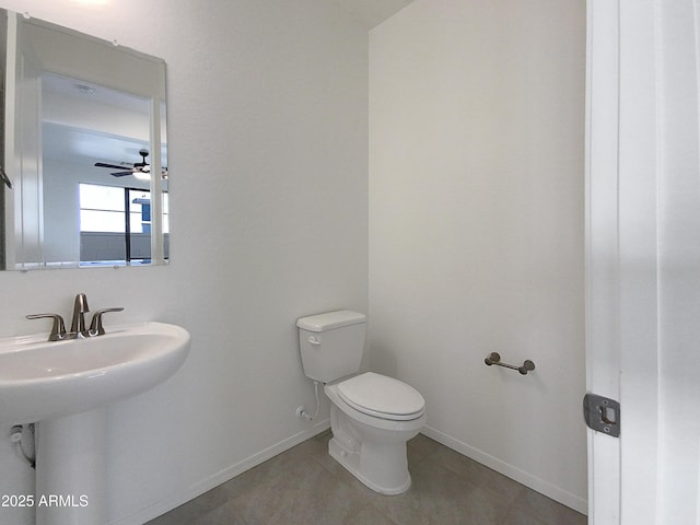 bathroom with sink, toilet, tile patterned floors, and ceiling fan