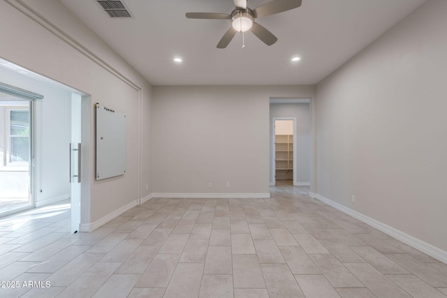 unfurnished room featuring ceiling fan