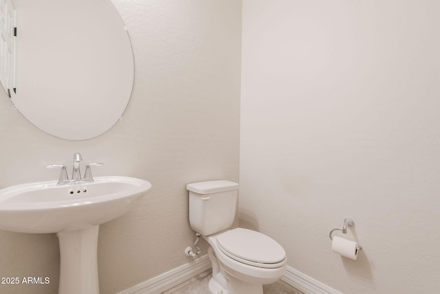 bathroom featuring toilet