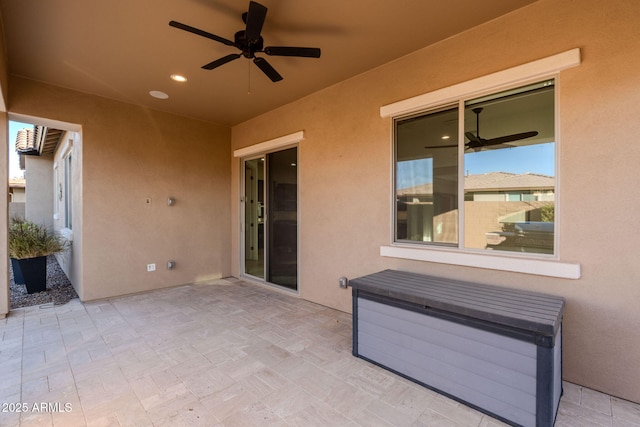 view of patio featuring ceiling fan