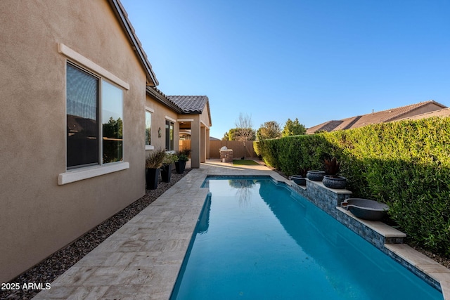 view of pool featuring a patio area