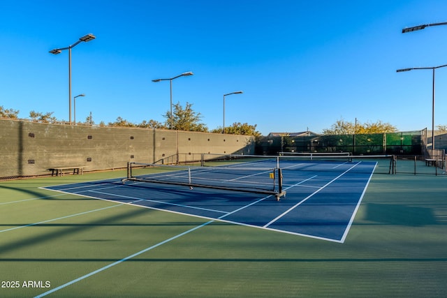 view of sport court with basketball hoop