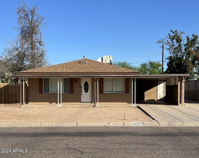 single story home with a carport