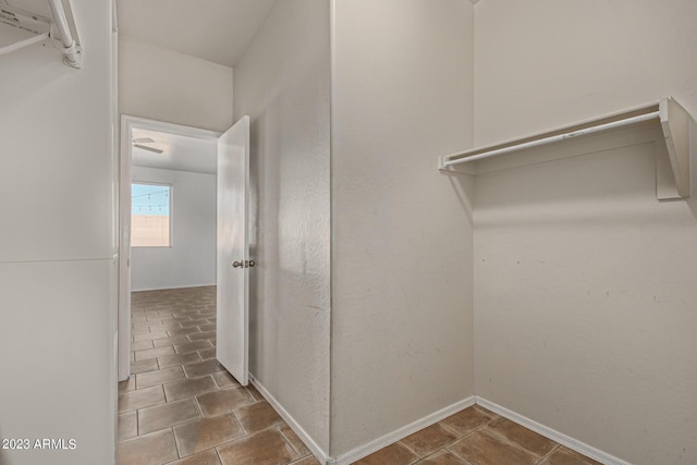 spacious closet featuring tile patterned floors