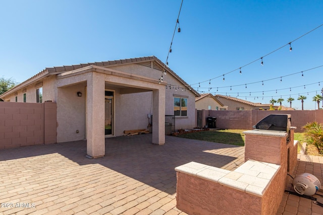 rear view of house featuring a patio