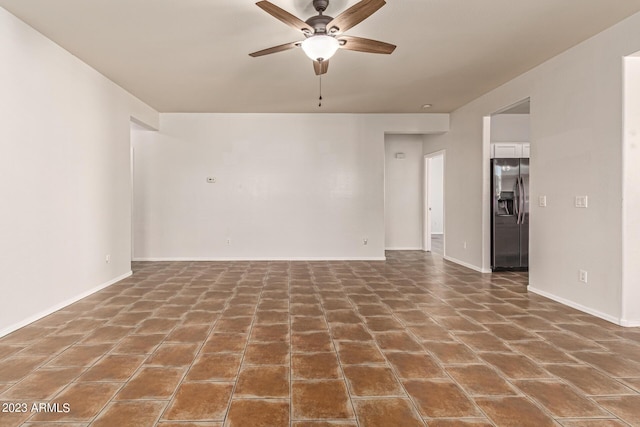 spare room with ceiling fan