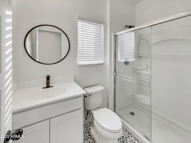full bath with toilet, a shower stall, and vanity
