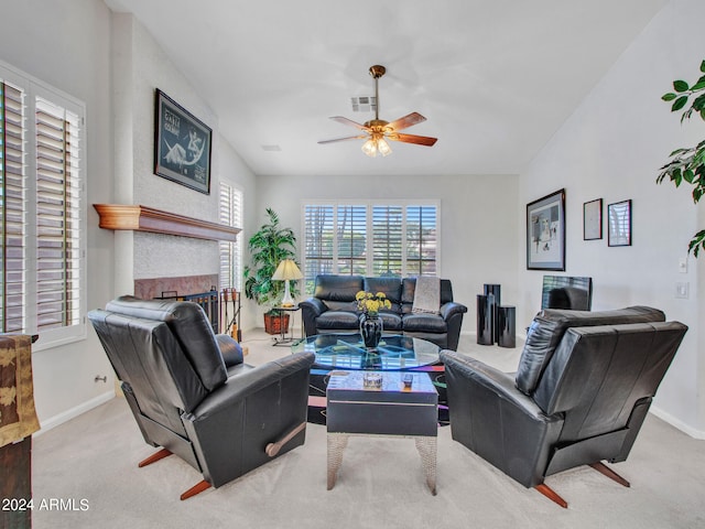 living room with vaulted ceiling, ceiling fan, and light colored carpet