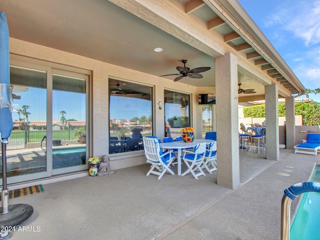 view of patio featuring ceiling fan