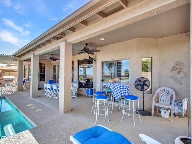 view of patio / terrace featuring ceiling fan