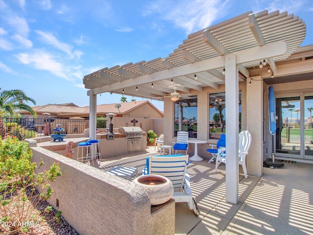 view of patio with a pergola, area for grilling, and an outdoor kitchen