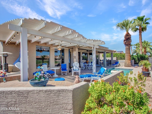 view of patio / terrace featuring ceiling fan and a pergola