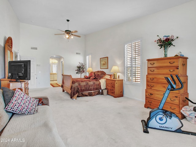 bedroom featuring light carpet and ceiling fan